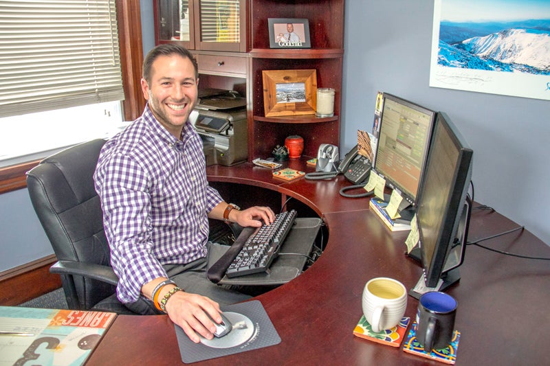 Michael Monastra working on a computer