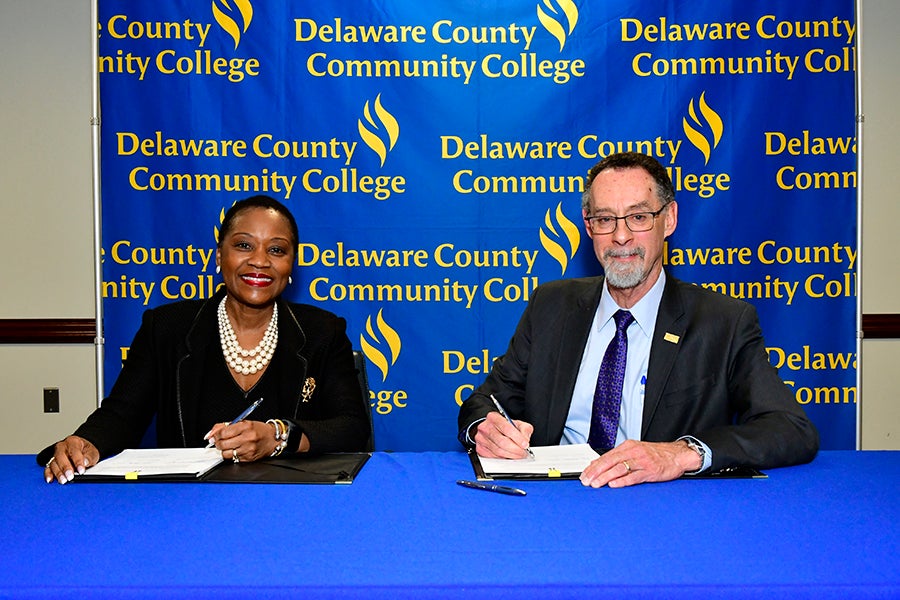 Dr. L. Joy Gates Black and West Chester University President Dr. Christopher M. Fiorentino sign the new West Chester University Bachelor of Science