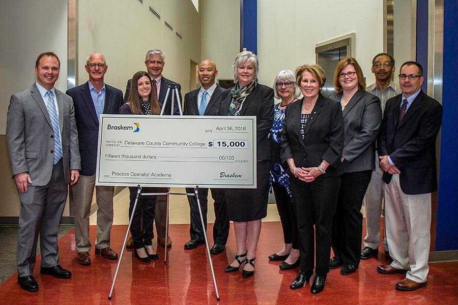 Group photo with large check