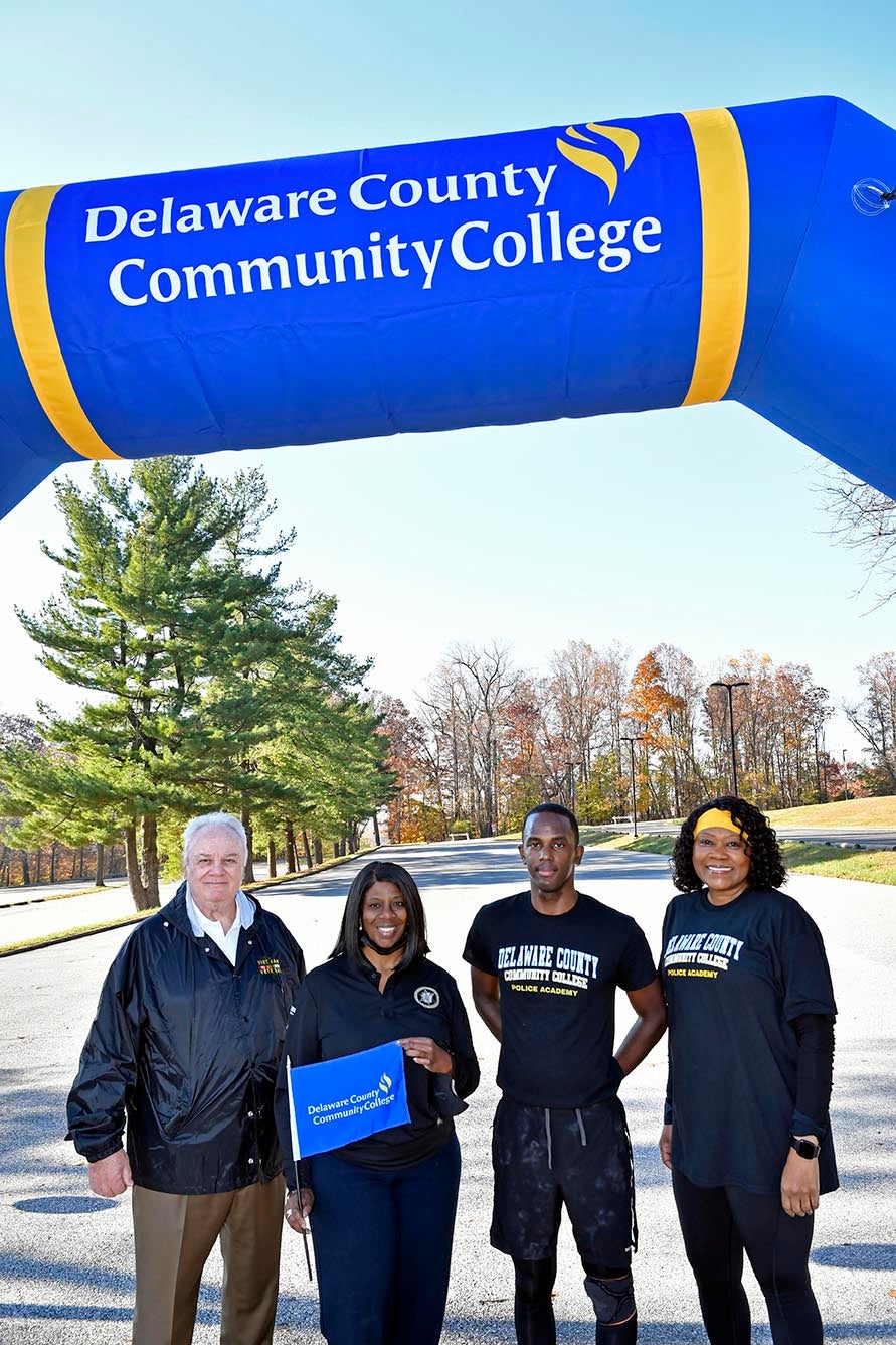 Municipal Police Academy (MPA) Director Bill Davis, Chester County Sheriff Fredda L. Maddox, MPA cadet/Act 120 scholar Brian Woodard, and Delaware County Community College President Dr. L. Joy Gates Black