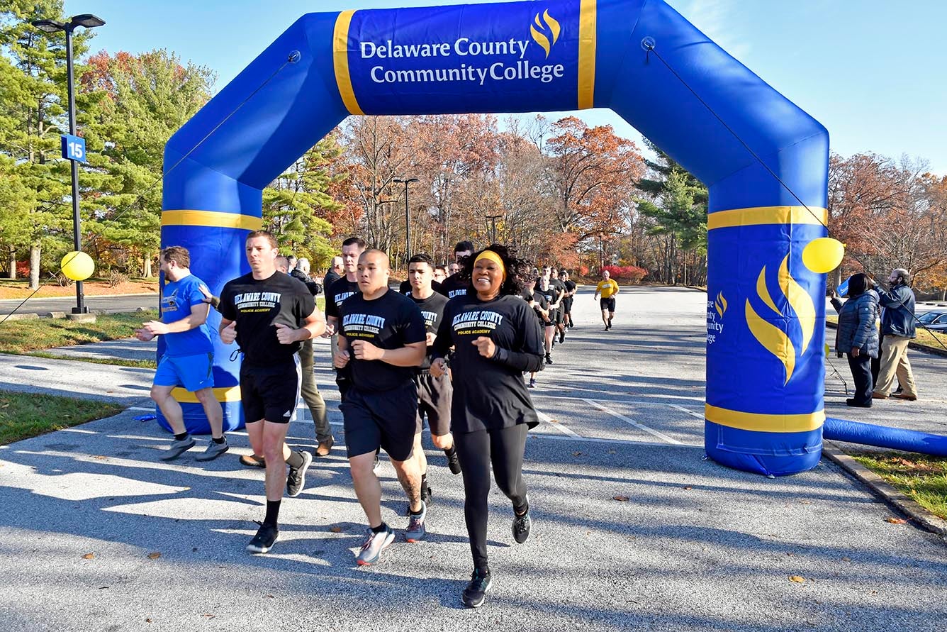 Photo of president running with cadets