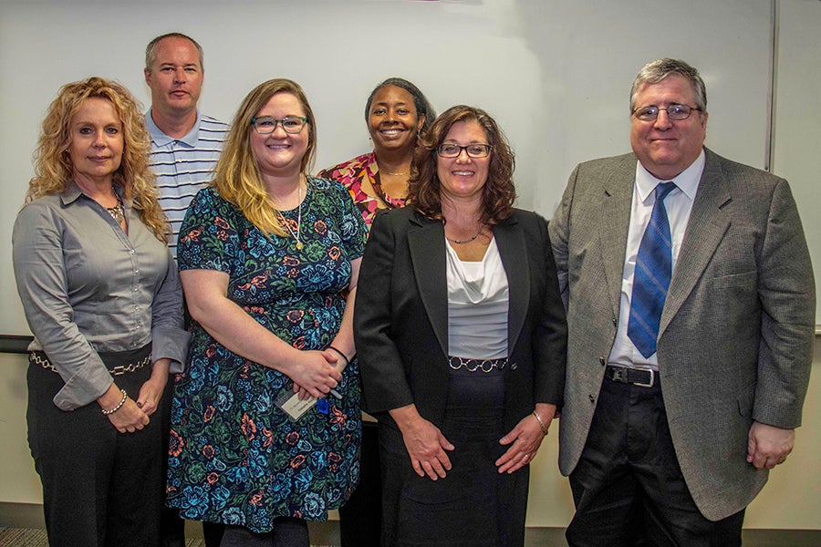 left to right: Marie McDevitt of Garnet Valley; Natalie Alsis, interviewer from Dunwoody Village; Deborah McArdle of Parkesburg; and Greg Sandborn of Paoli. Back row, from left to right: Doug Ferguson, interviewer and Director of Alumni Relations at Delaware County Community College, and interviewer Terri Cooper-Smith, of the Pennsylvania Public Utility Commission