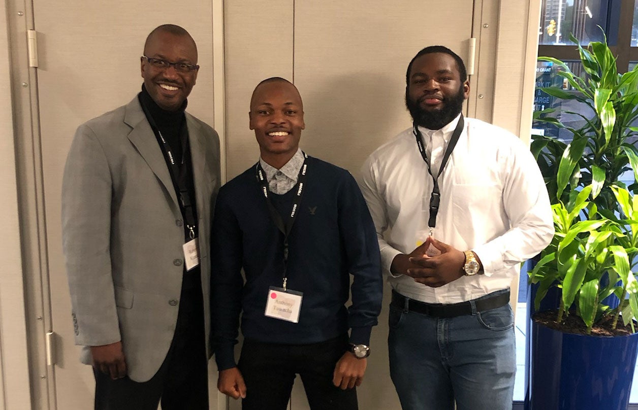 Robert Wrease Jr. with students Tadiwanashe “Antony” Tuwacha and Zahkee Hawkins in Pittsburgh