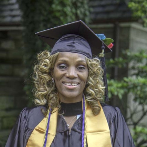 Student posing in cap and gown