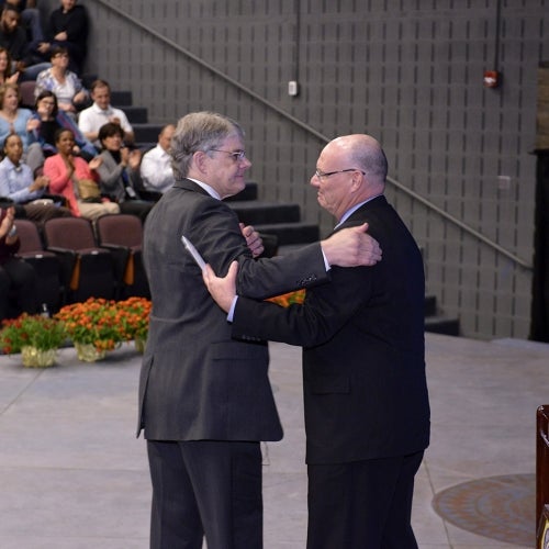 Jerry and John Glavin hug